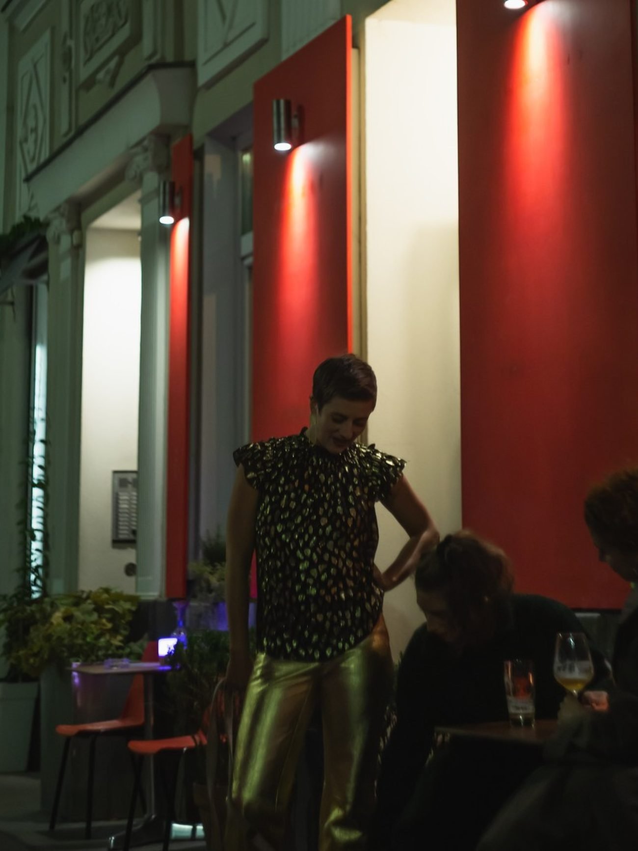 The Gastgarten at night with warm red light